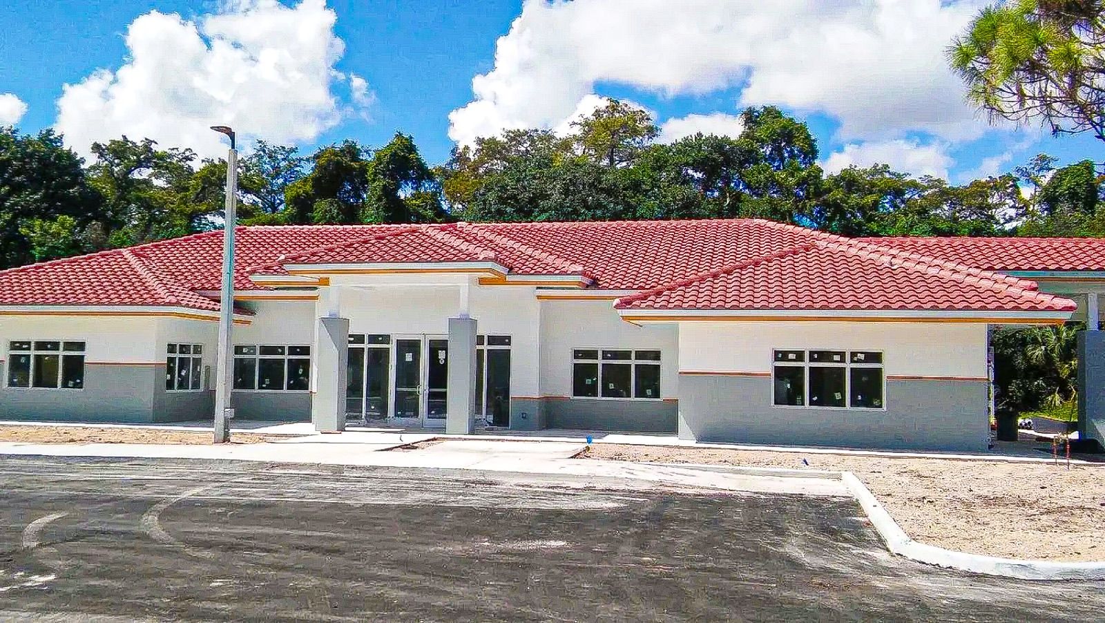 Newly built single-story home with tile roof