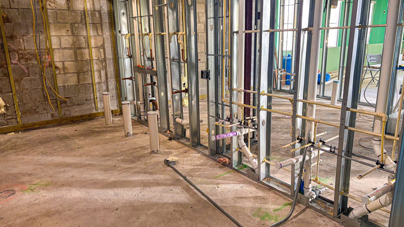 Commercial rough-in plumbing in steel stud walls
