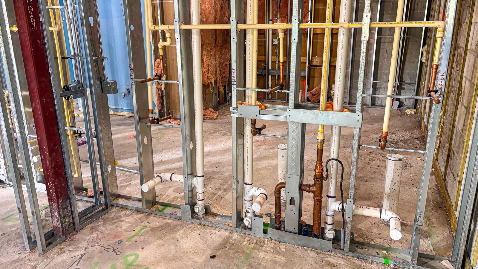 Plumbing rough-in through steel framing