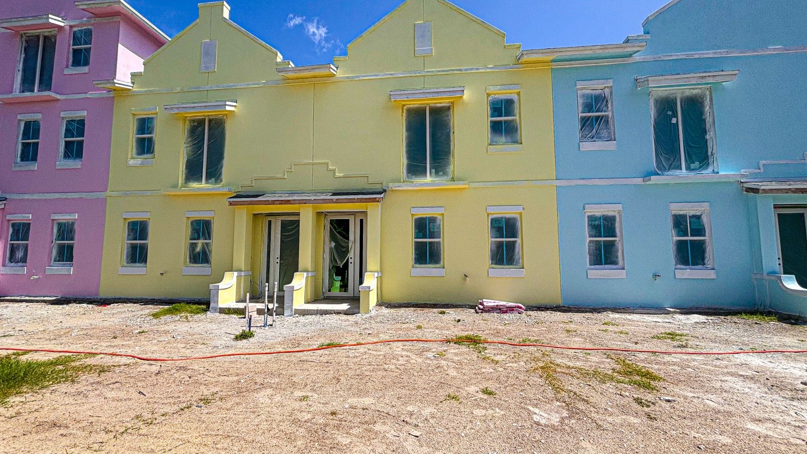New townhomes with pastel exteriors