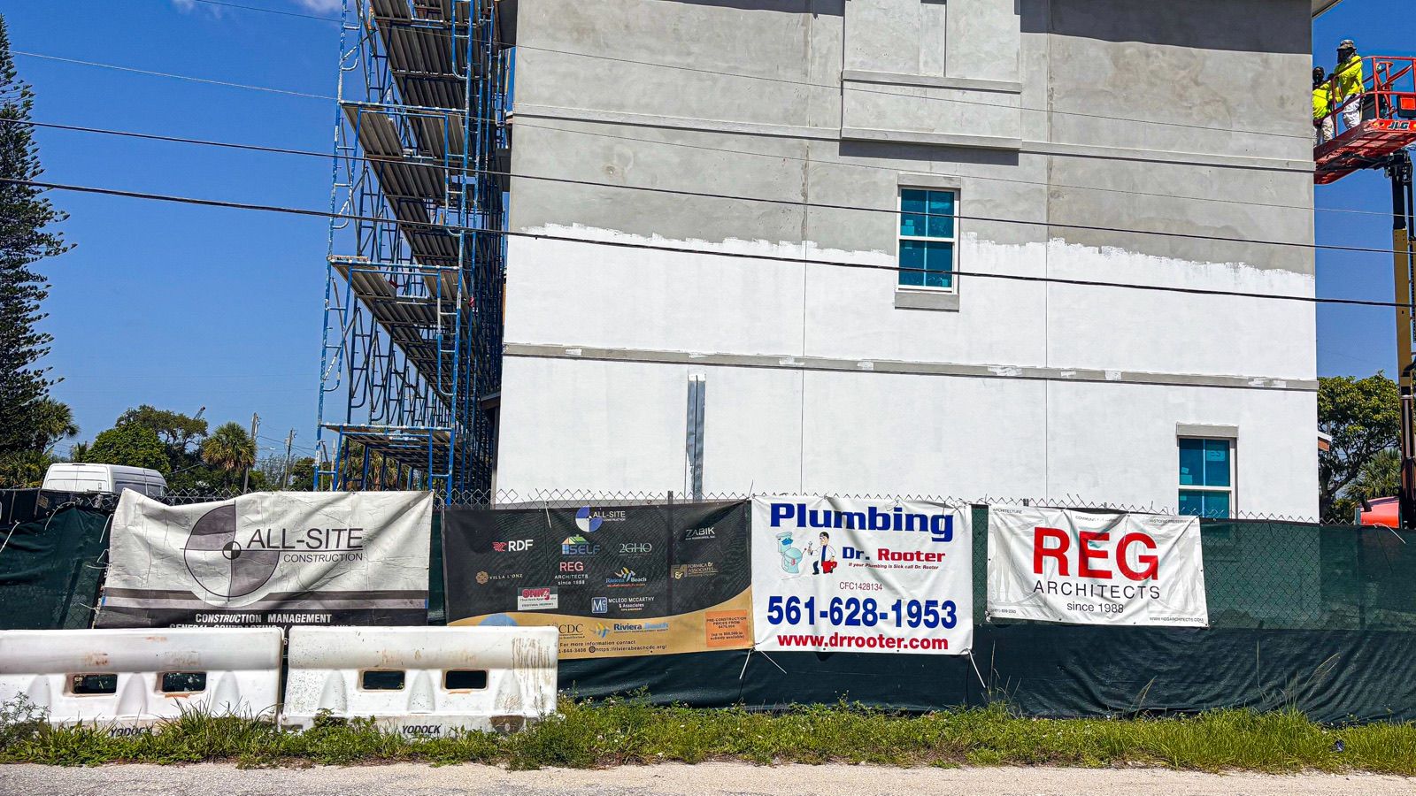 Commercial construction site with Dr. Rooter Plumbing signage